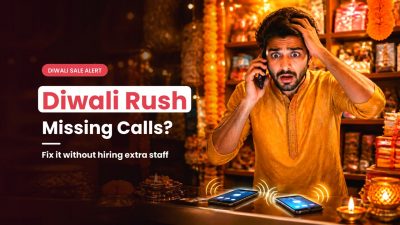 Stressed Indian shop owner answering a call while more phones ring on the counter during a busy Diwali festive season call