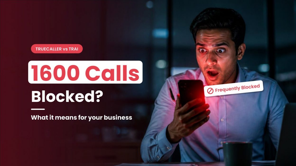 Shocked businessman looking at his phone as a 1600 series business call shows a Frequently Blocked warning on Truecaller